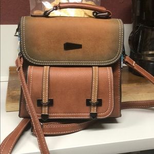 Faux leather backpack and reversible handbag